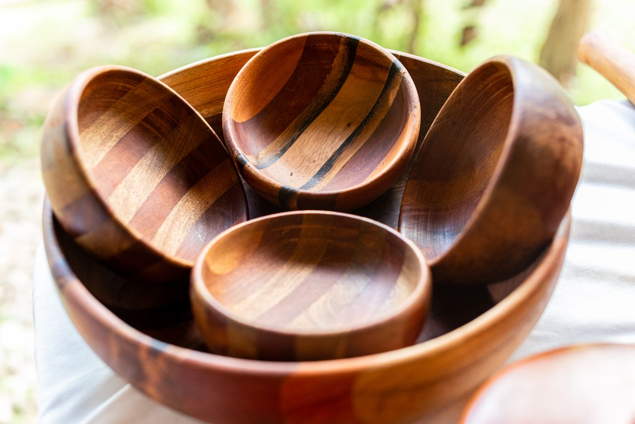 A collection of artisanal wooden bowls on display, showcasing natural craftsmanship.